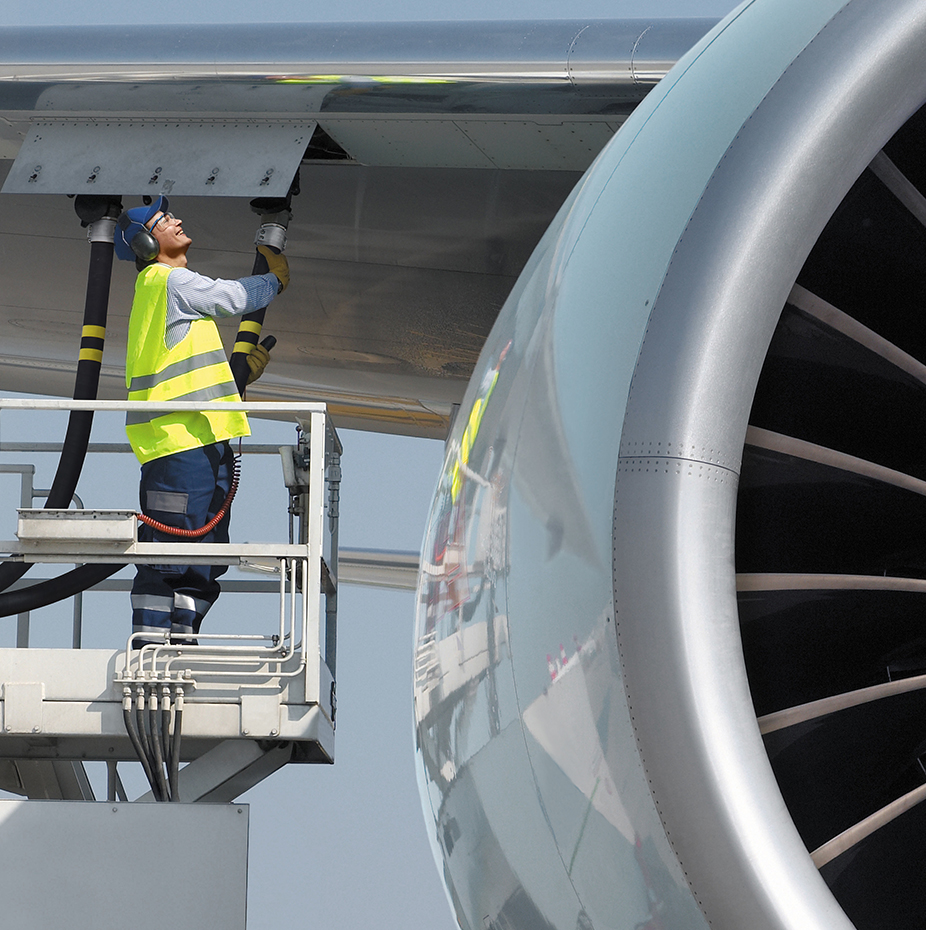 Large Jet engine and guy refuelling aircraft - The Best Fuelling Equipment Supplier in Asia